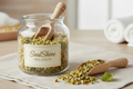 chamomile and lemon balm in glass jar with spoon that says SoulShine Wellness like the other one